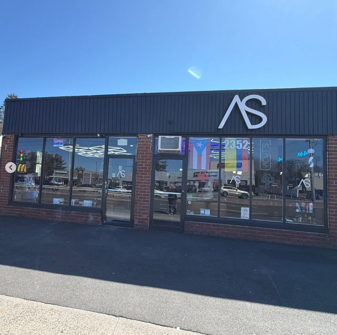 A Cuts Studio storefront exterior from the street